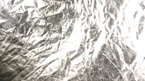 4K shiny silver background waving in the wind crinkle floating sheet flag  Stock Footage 88274823