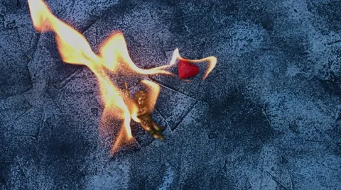 4k shoot of a creative composition with an angel and heart on fire 스톡 동영상 64264276