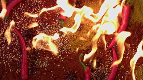 4k shoot of a creative composition with chilli and spices on fire Video stock 64268016