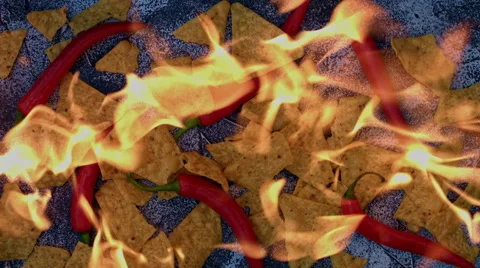 4k shoot of a creative composition with crisps and chilli on fire Video stock 64266338