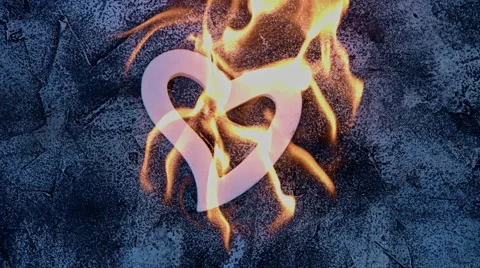 4k shoot of a creative composition with heart on fire Stock Footage 64266350