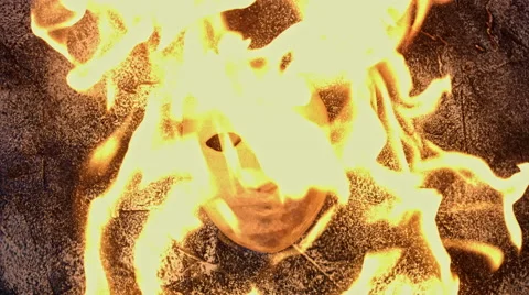 4k shoot of a creative composition with a mask on fire 스톡 동영상 64268097