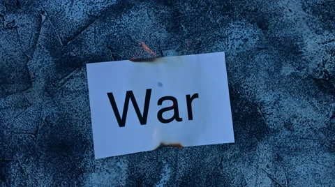 4k shoot of a creative composition with war word on fire Stock Footage 64269575