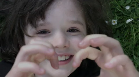 4k shoot of a cute child posing and smiling at camera Stock Footage 63350512
