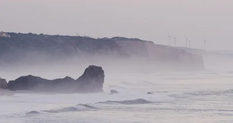 4K shot of Atlantic ocean waves crashing against coastal cliffs in Portugal Video stock 163085089