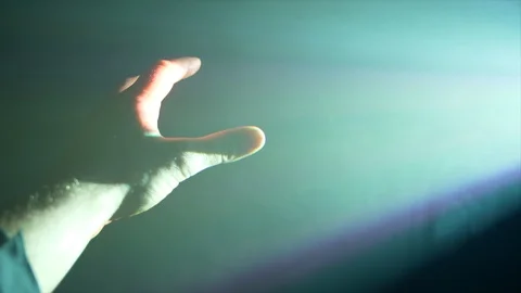 4K Shot Of Beautiful Rays Of Light Shining Hand Touching Light Covered In Smoke Stock Footage 122739027