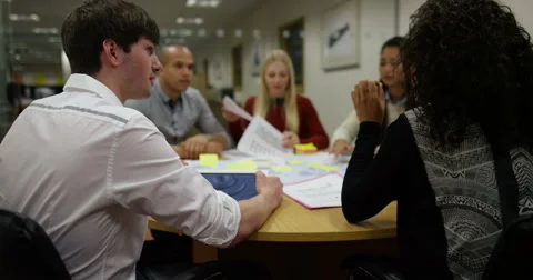4k shot of a business team working hard while they research and compare results  Stock Footage 61547423