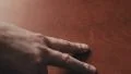 4K shot of caucasian hand counting to five on wooden table using the fingers 4k or 4k+ Resolution