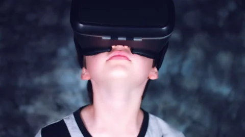 4k Shot of a Child Putting on Virtual Reality Headset and looking Around Stock Footage 68344459