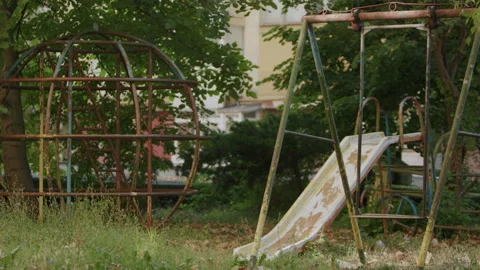 4K shot of  an empty, abandoned playground, destroyed slide. Stock Footage 220307483