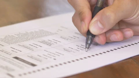 4k Shot of a hand filling out a voting ballot Stock Footage