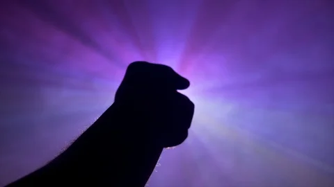 4K Shot Of Hand Reaching Out  And Opening Out Towards Beautiful Rays Of Lights Stock Footage 122739484