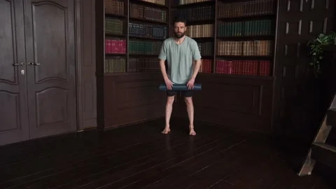 4k Shot Of A Man Rolling Out Yoga Mat at Home Stock Footage 152567751