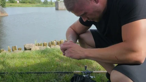 4k shot of a man's hand before reeling in a fly fishing pole Video stock 84004152