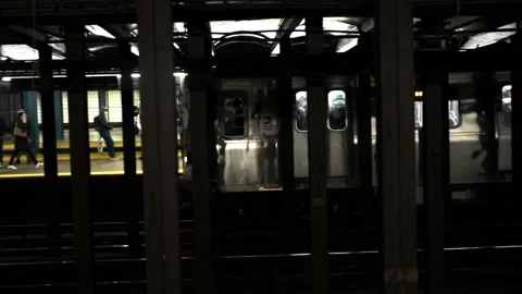 A 4k shot of a metro subway train traveling in the underground station in Stock Footage 237144533