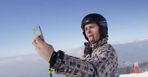 4K Shot Of Skier Taking Selfie On Mountain Top On Sunny Winter Day Stock-Footage 47089080