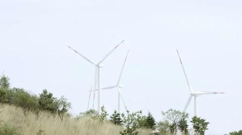 4k shot of windmills on fields. Video stock 40549183