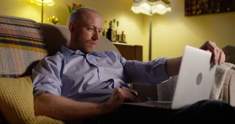 4k shot of a young man using a laptop while working from home Stock Footage 128366606