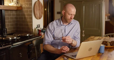 4k Shot of a young man using a credit card to make an online payment at home Stock Footage 128381671