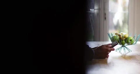 4k  Shot of a young man working from home using smart phone Stock Footage 130631447