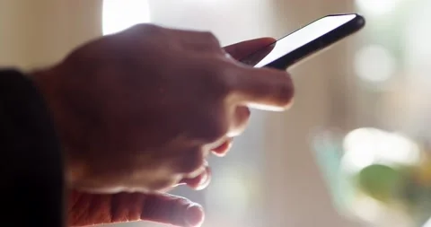 4k  Shot of a young man working from home using smart phone Stock Footage 130639559