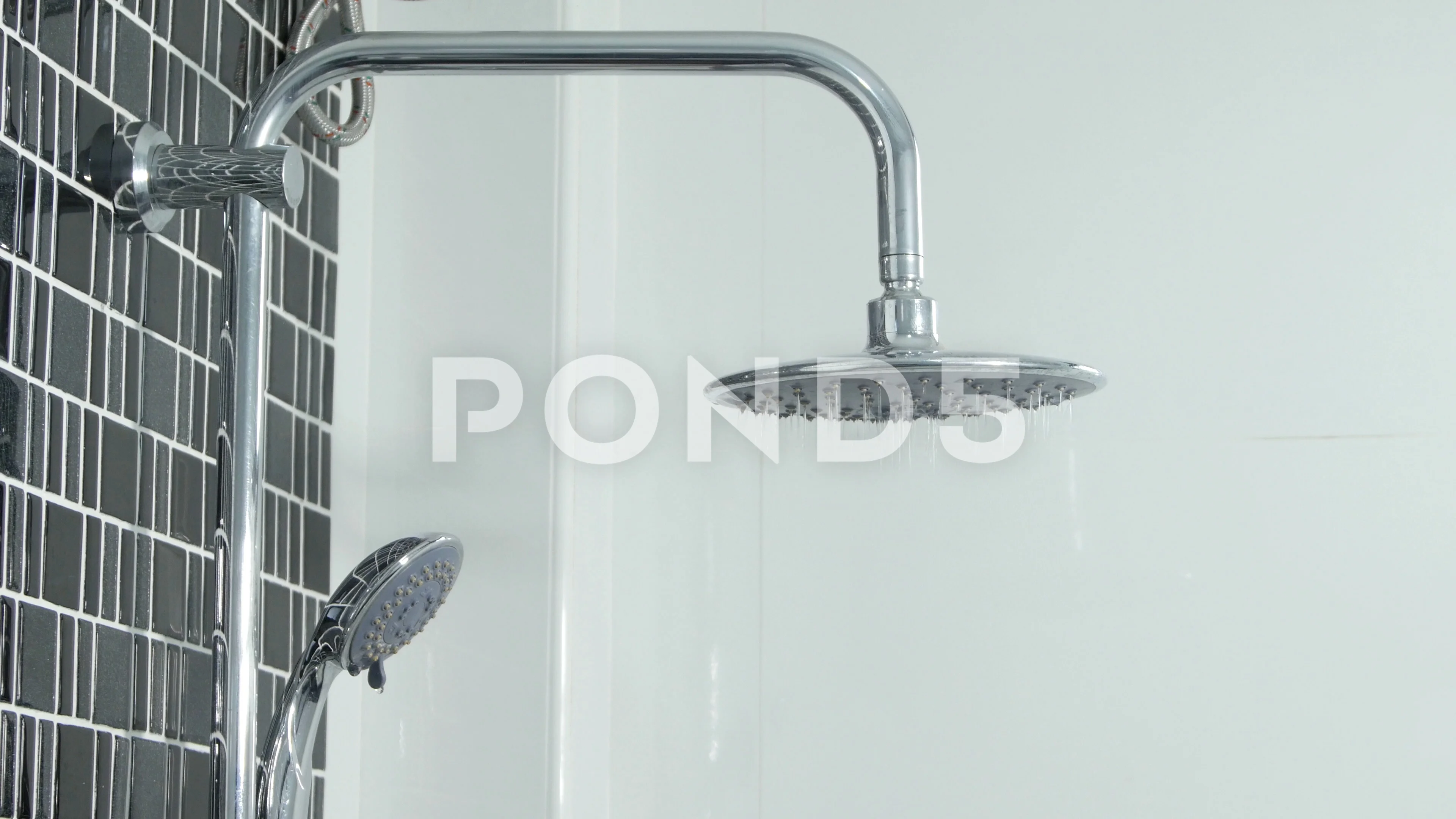 4k of Shower head water starts to flow i... | Stock Video | Pond5
