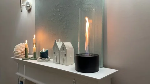 4K - Side Angle View Of Tabletop Bioethanol Fireplace On Fireplace Mantel Stock Footage 345364089