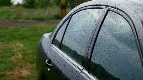 4K The side view of the black car under the rain Stock-Footage 97521485