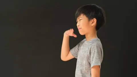 4k side view, young Asian boy has problem with air pollution  Stock Footage 126816936