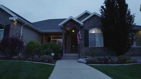 4K Sidewalk Dusk Footage of Upper Middle Class Ranch Home at Base of Rockies Stock Footage 154073162