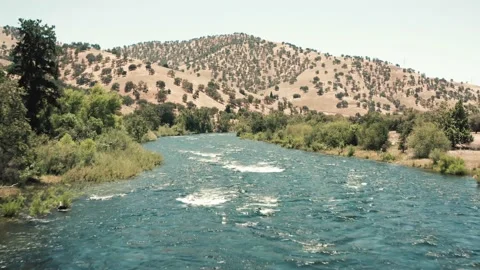 4K Sierra Nevada River Downstream Aerial Flight Stock Footage