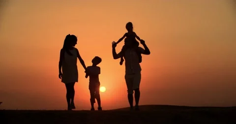 4k silhouette of a family, father mother and two children son and daughter Stock Footage