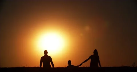 4k silhouette of a family, father mother and two children son and daughter Stock Footage