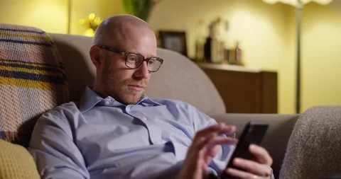 4k, Single man swiping through different profiles on a dating app Stock Footage 128405230
