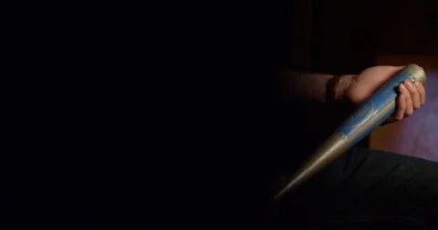 4k Sinister vicar holding a baseball bat with serious expression Stock Footage 128401113