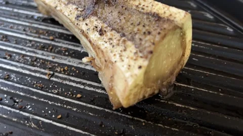 4K sizzling grilled beef bone marrow just out of oven Stock Footage 251180315