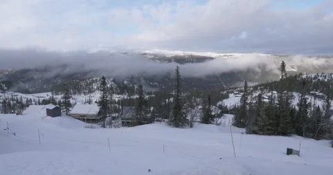 4k - Ski cabins on Norweigian mountainside Stock Footage