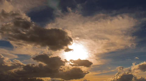 4K sky sunset time lapse storm clouds clear sun emerges Stock Footage