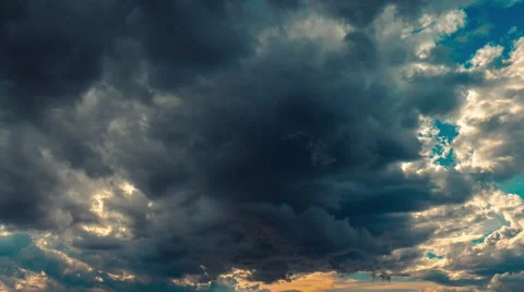 4K sky sunset time lapse storm clouds disperse sun emerges 30p Stock Footage 49549027