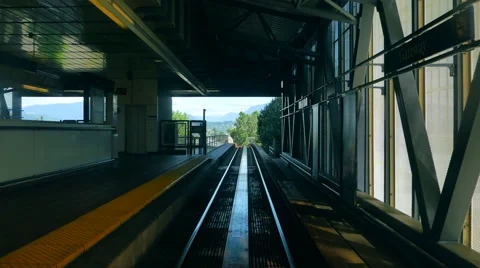 4K Skytrain Subway Train Station, Train Passes Platform, Comes to Stop Stock Footage 65579181