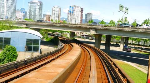 4K Skytrain Train Tracks POV Transit Under Bridge Vancouver Stockbeeldmateriaal 65564629