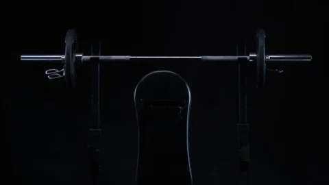 4K Sleek black gym equipment against bla... | Stock Video | Pond5