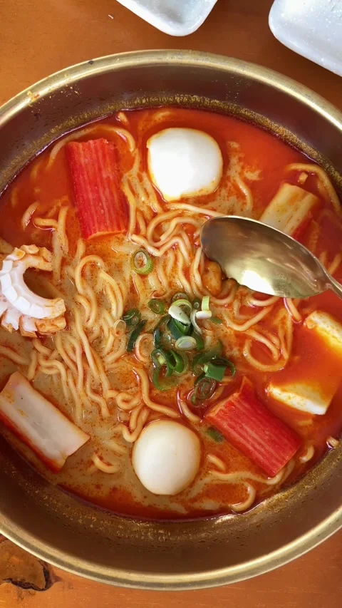 4K Slo Mo Cinematic: Close-Up Scooping Spicy Tom Yum Noodle Soup with Brass Spoo Stock Footage 338278067
