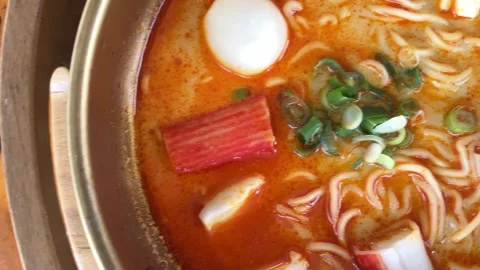 4K Slo Mo Cinematic: Close-Up of Spicy Tom Yum Soup Served on Wooden Tray Stock Footage 338278226