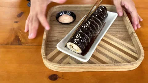 4K Slo Mo Cinematic: Serving Plate of Korean Gimbap and Sauce on Wooden Tray Stock Footage 338278821