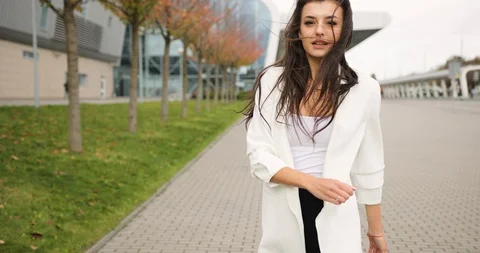 4k. Slow and fast motion. Fancy dressed young business woman in black and white Stock Footage 99303445