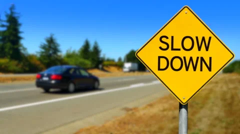 4K Slow Down, Yellow Diamond Sign, Seamless Looping Stock Footage 68167155