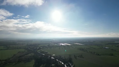 4K Slow Drone Glide Over Sunlit UK Countryside Stock Footage 296225997
