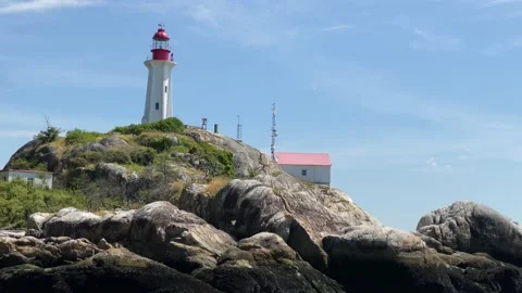 4K slow mo lighthouse sea Stock Footage 135780164