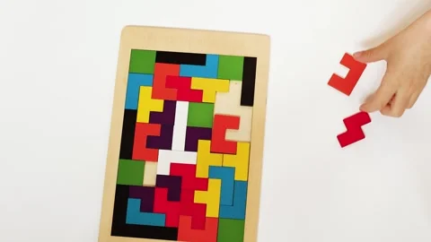 4K slow motion 60 fps footage of a little child hand holding a red block whil Stock Footage 345525004